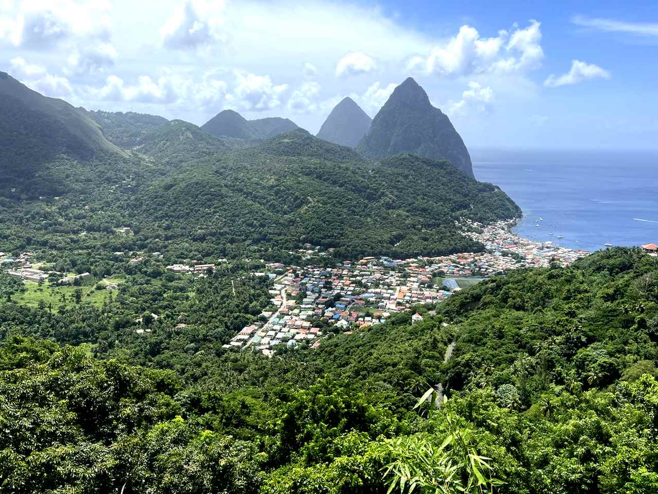 pitons-in-the-distance Soufriere, in the caldera of a dormant volcano overlooked by Pitons.
